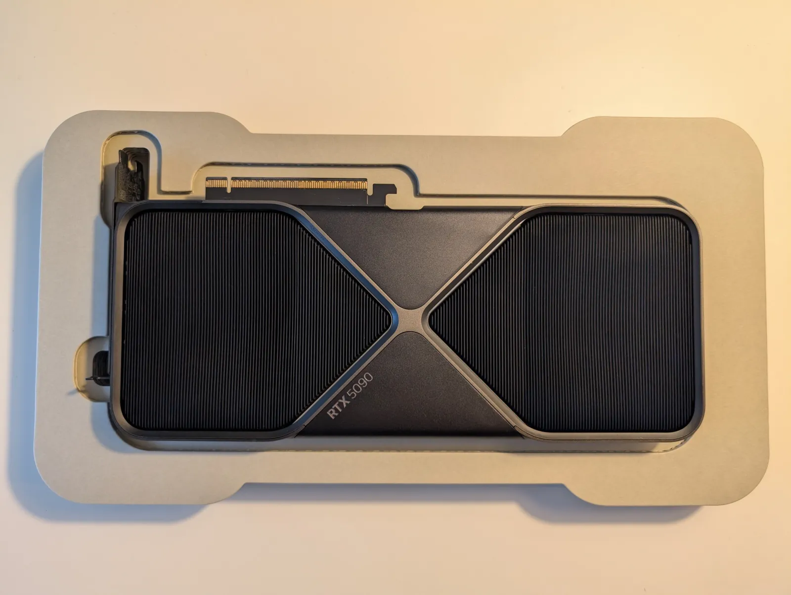One of the two graphics cards: an NVIDIA GeForce RTX 5090 Founders Edition, fresh out of the box.
